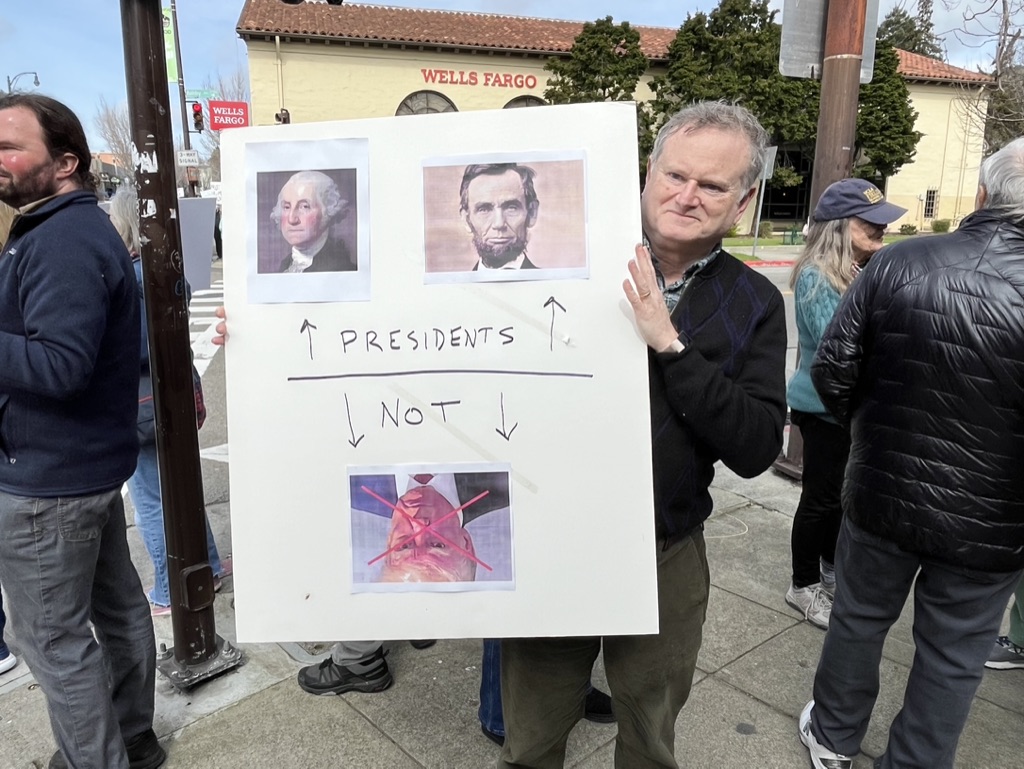 Author with protest sign