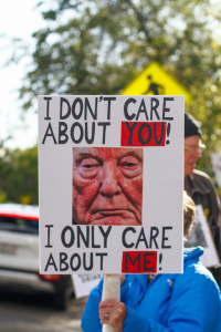 Protestor with anti-Trump sign