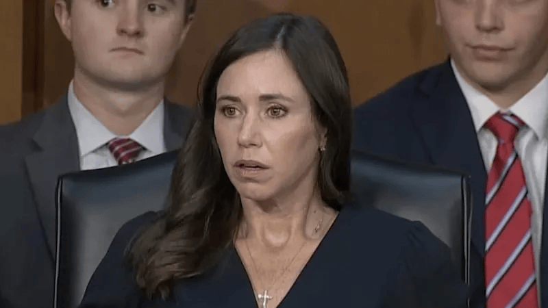 Sen. Katie Britt with a look of horror on her face